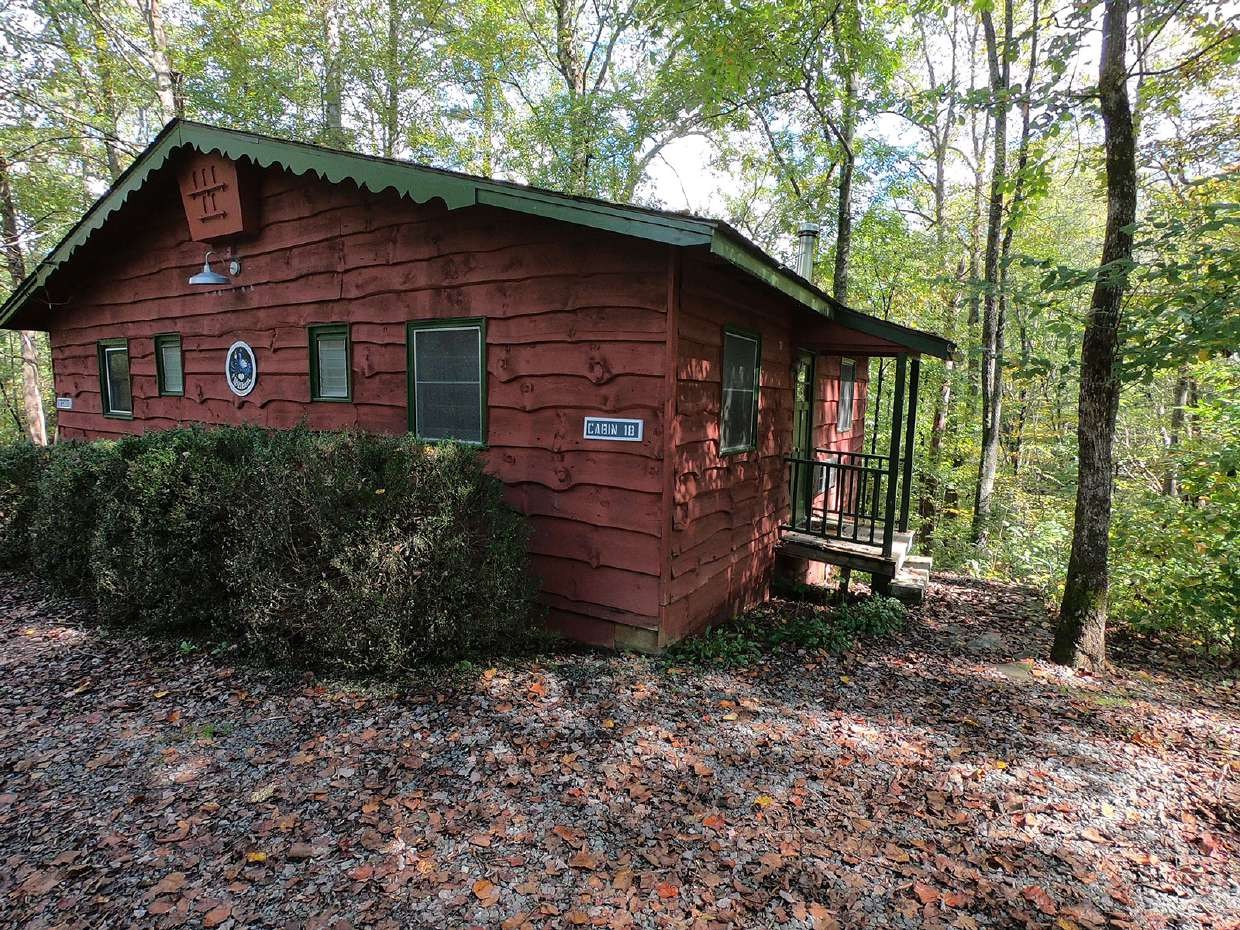 Red wood cabin among the trees